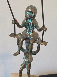 lot 74 image: Mid Century Bijan Children on a Swing Metal Sculpture