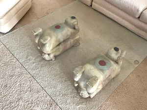 lot 18 image: Unique and Fun Glass Top Coffee Table with Figurine Bases