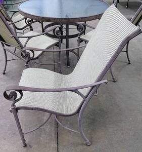 lot 56 image: Outdoor Patio Set 48 Metal and Glass Table with 4 Chairs