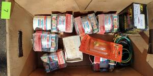 Box of oil filters and a box of misc old parts