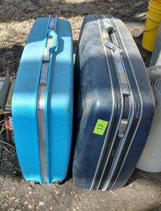 3 hard sided pieces of luggage, one is a samsonite