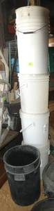 Stack of 7 pails 3 with covers
