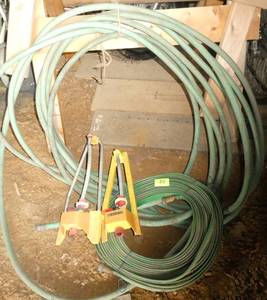 2 garden hoses and 2 sprinklers