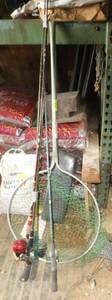 3 fishing rods and a net