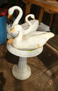 Plastic bird bath and geese