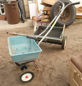 2 seeders and a bag of fertilizer