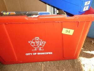 Red tote with 6 blue parts bins and misc parts