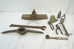lot 65 image: antique tools including clamps, wrench, punch, crank, pick-axe