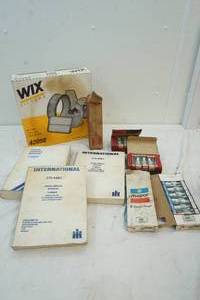 lot 71 image: Wix air filter 42098, new spark plugs, International truck service manuals