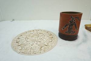 lot 234 image: Inca sun dial wall decor, Inca carved vase
