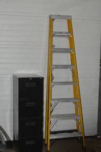 lot 10 image: 8 foot tall Husky Ladder and filing cabinet