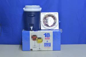 lot 25 image: New Wine Glasses and storage box, Rubbermaid liquid container and a butterfly collectors plate