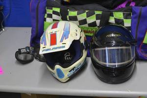 lot 81 image: Arctic Cat duffle bag filled with items shown