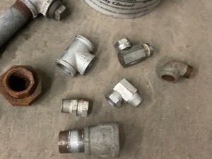 lot 17 image: (2) Buckets Of Assorted Pipe Fittings & More -- See All Pics