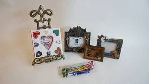 lot 50 image: Metal table top easel assorted picture frames