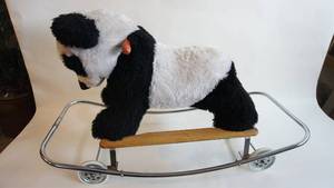 lot 1 image: RARE Antique Trudi Riding Panda Bear on Wheels.  Stuffed PullRiding Toy with Handles.  Top quality made of chrome piping and wooden handlesrails.  Original tags. RubberMetal Wheels with Metal Frame.  Made in Italy.