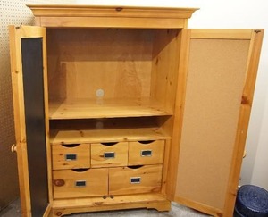 lot 89 image: 44 x 26 x 63 Pottery Barn shelving unit, entertainmentstorage center with inner chalkboardcorkboard doors, solid piece
