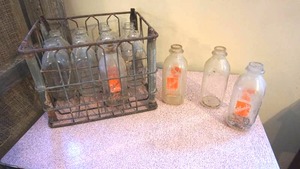 lot 152 image: Metal crate with milk bottles