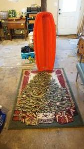 lot 167 image: Plastic toboggan and 60 x 40 Christmas rug