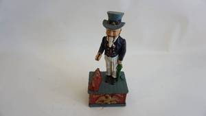 lot 188 image: Antique cast-iron Uncle Sam Bank Mechanical