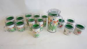 lot 254 image: Plastic Therma-Serv beverage set includes10 inch tulip patterned pitcher, Six-6 inch tulip tumblers, Four-4 12 inch tulip cups, four fruit blossoms handled cups