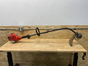 lot 23 image: HOMELITE 2-Cycle 26 CC Curved Shaft Gas Trimmer