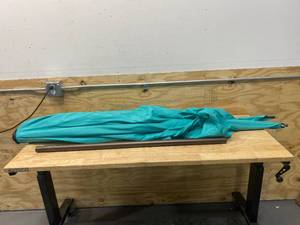 lot 13 image: ABBA PATIO 10 ft. x 6.5 ft. Rectangular Market Patio Umbrella Outdoor with Push Button Tilt and Crank in Turquoise (for parts or repair)