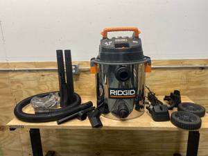 lot 97 image: RIDGID 16 Gallon 6.5-Peak HP Stainless Steel WetDry Shop Vacuum with Fine Dust Filter, Hose and Accessories