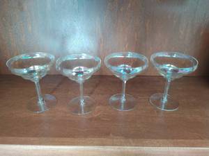 lot 61 image: Four Iridescent Carnival Glass Goblets
