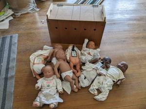 lot 495 image: 8 realCare dolls (most have control...