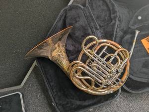 lot 100 image: French horn in case...