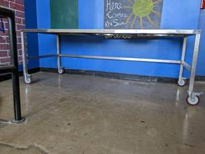 lot 577 image: Large Stainless steel table on whee...