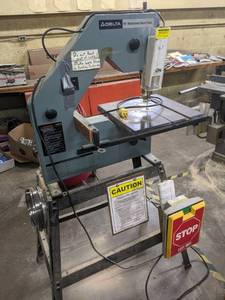 lot 2 image: Delta 16 inch motorized band saw on...