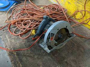 lot 45 image: Skilsaw and long extension cord...