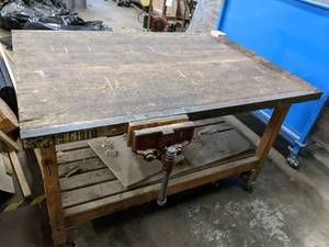 lot 56 image: Work table on wheels with clams on ...