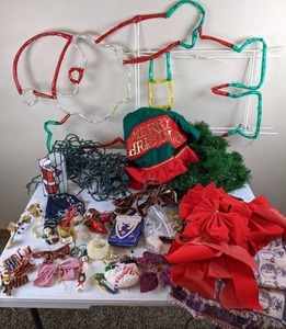 lot 138 image: Christmas Decor Large Santa, Red Christmas Bows, Lights, Small Bows, Garland, Tree Skirt, & More