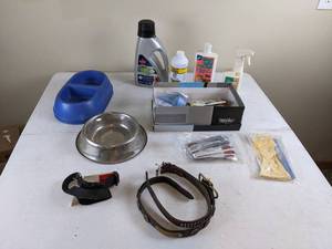 lot 195 image: Assortment of Pet Supplies & Pet Cleaning Supplies Bissell, OXY, Stanley Steamer, Cat Shampoo, Etc.