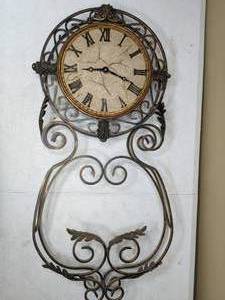 lot 61 image: Metal Scroll-Work Wall Clock