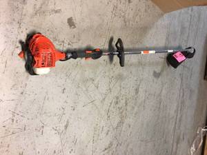 lot 62 image: 21.2 cc Gas 2-Stroke Cycle Straight Shaft Trimmer by ECHO Customer Returns See Pictures