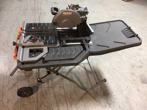 lot 101 image: 10 in. Wet Tile Saw with Stand by RIDGID Customer Returns See Pictures