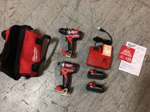 lot 110 image: M18 18-Volt Lithium-Ion Brushless Cordless Compact DrillImpact Combo Kit (2-Tool) W (2) 2.0Ah Batteries, Charger & Bag by Milwaukee Customer Returns See Pictures