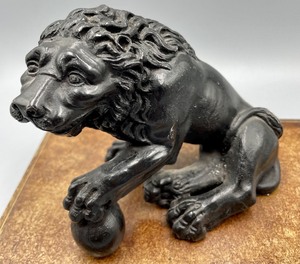lot 262 image: Resin Lion Figure on a Faux Book