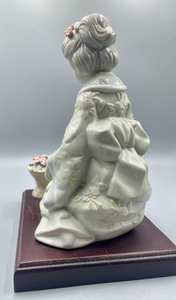 lot 166 image: Vintage Porcelain Kneeling Geisha Girl Figurine on a Wood Base