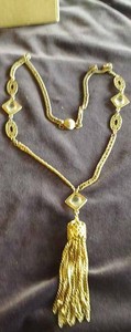 Two Necklace and Earring Sets and a Third Gold Colored Necklace