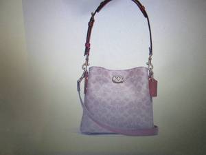 lot 93 image: Coach Willow Signature Bucket Bag  Tan