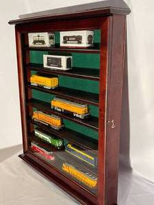 lot 115 image: Vintage Wall Mount Display Case With Glass Door and Vintage Train Pieces