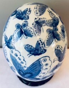 lot 234 image: Decorative Porcelain Egg on a Wooden Stand