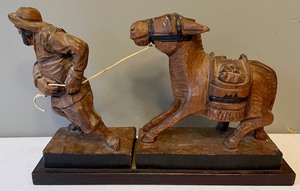 lot 284 image: Wooden Miner Pulling a Donkey Sculpture