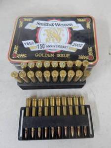 lot 48 image: 29 Rounds .30-06 & Smith & Wesson Tin