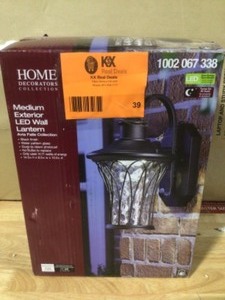 lot 39 image: Home Decorators Collection Avia Falls Black Outdoor LED Dusk to Dawn Wall Lantern Sconce Open box